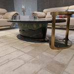 Oval Marble-Top Coffee Table with Sculpted Base and Natural Wood Veneer Detailing